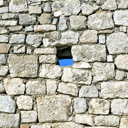 Image of a hole in a brick wall