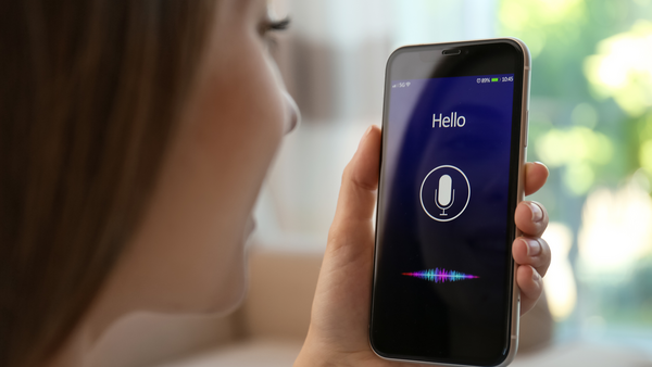Woman Speaking to AI on Cellphone